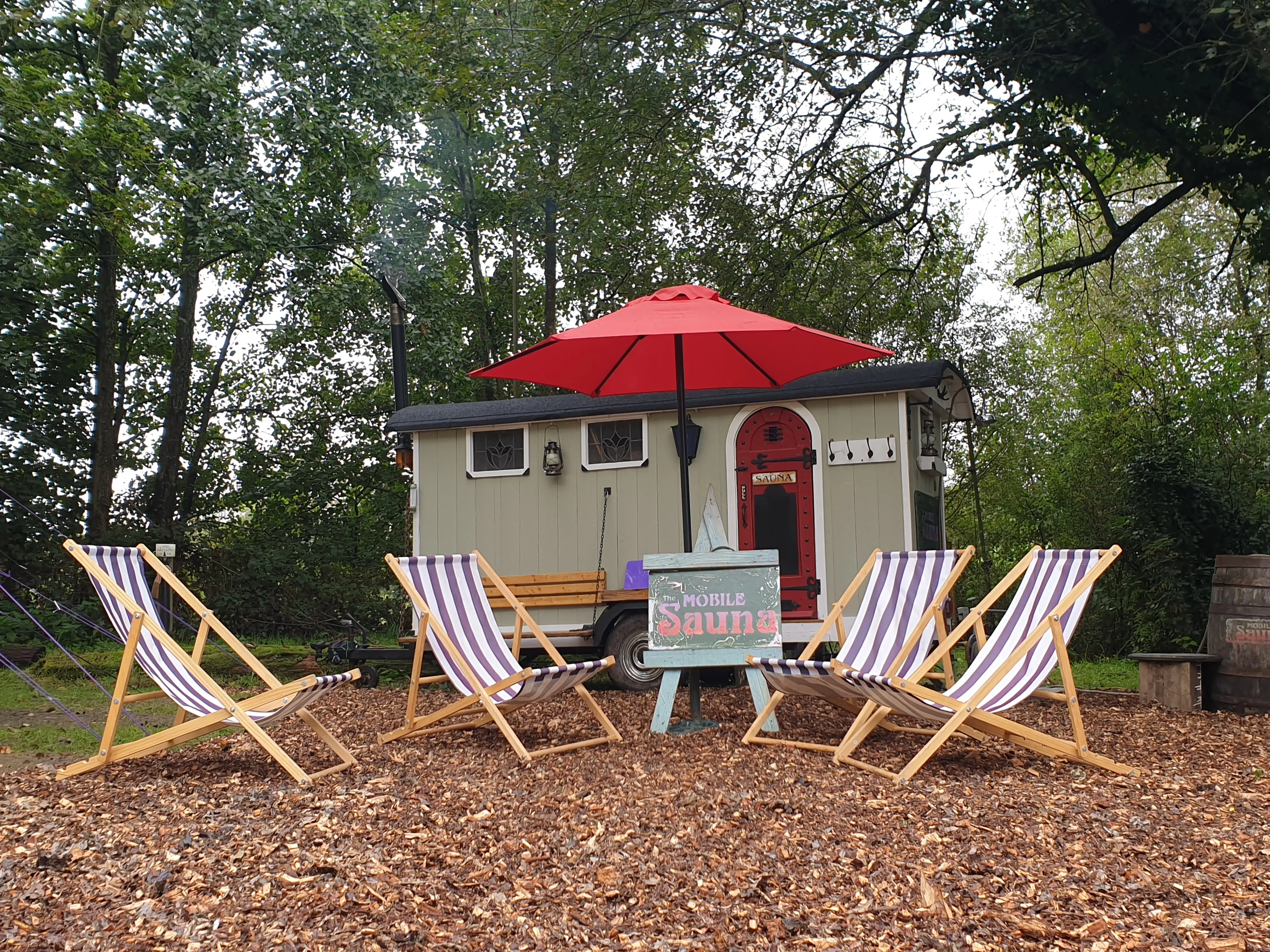 Deckchairs in a woodland clearing for cooling off between rounds